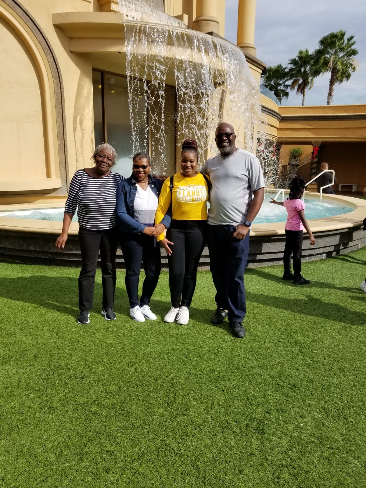 Choice Ministries Brunswick – group of four at resort with waterfall